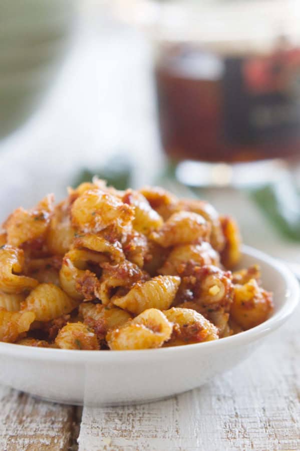 Sun Dried Tomato Pesto Pasta Salad in a white bowl.