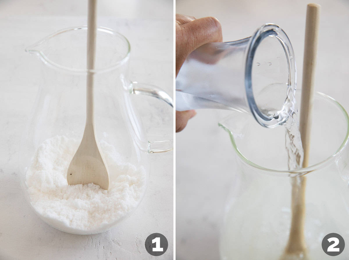 Making lemon water in a large pitcher.
