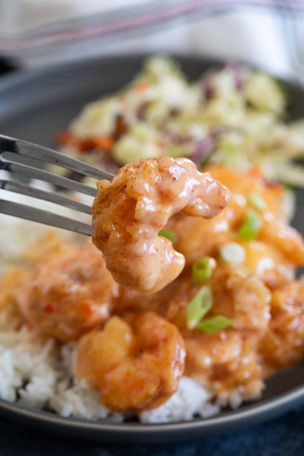 Piece of Bang Bang Shrimp on a fork.