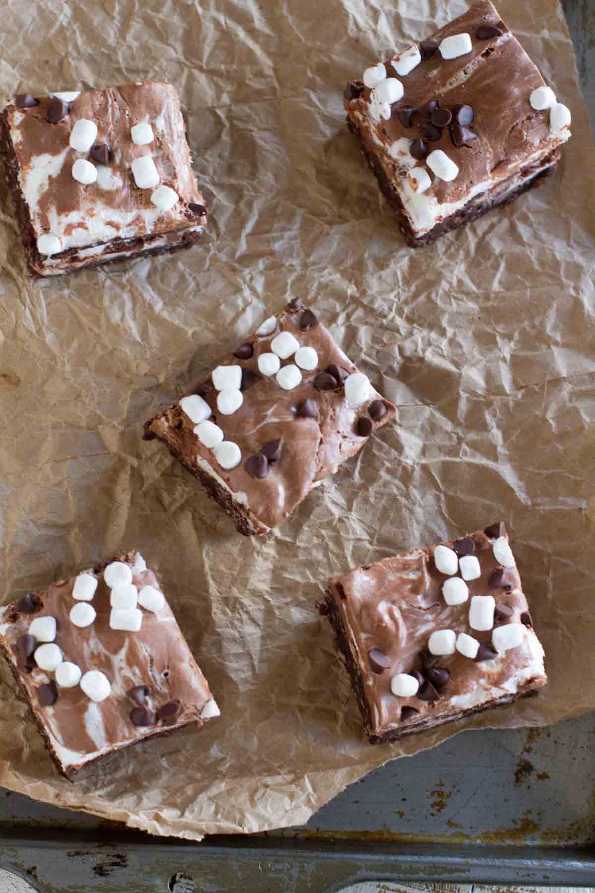 Marshmallow Coconut Brownies topped with mini marshmallows and chocolate chips cut into squares.