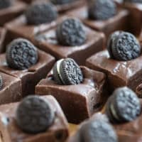 Squares of Oreo Fudge topped with mini Oreo cookies.