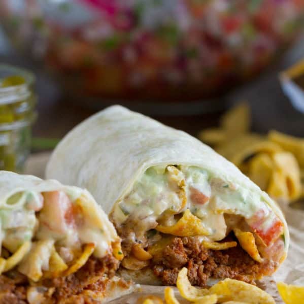 Frito Pie Burrito with chili, Fritos, pico de Gallo, and green Chile queso.