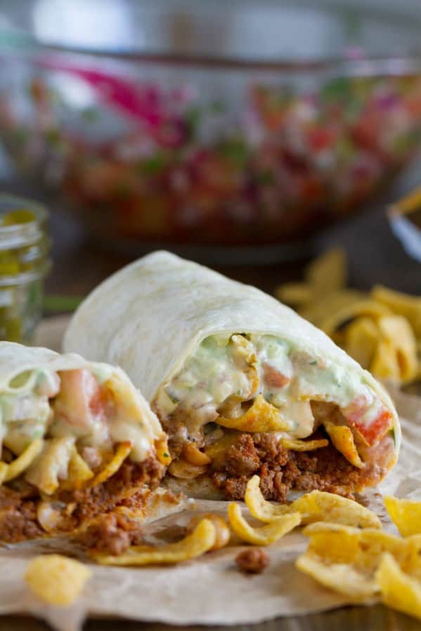 Frito Pie Burrito with chili, Fritos, pico de Gallo, and green Chile queso.