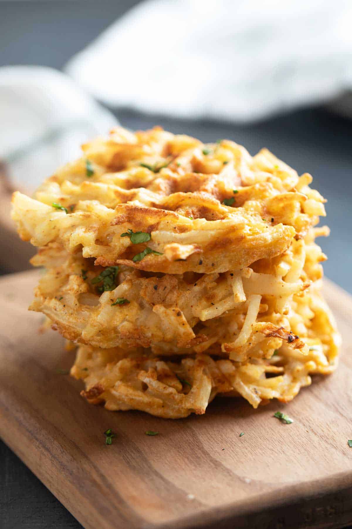 Three Hash Brown Waffles stacked on top of each other.