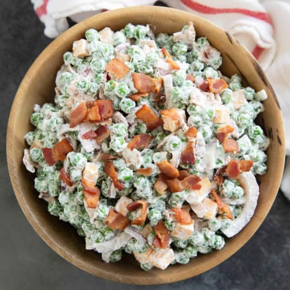 Pea Salad with bacon and cheese in a large bowl.