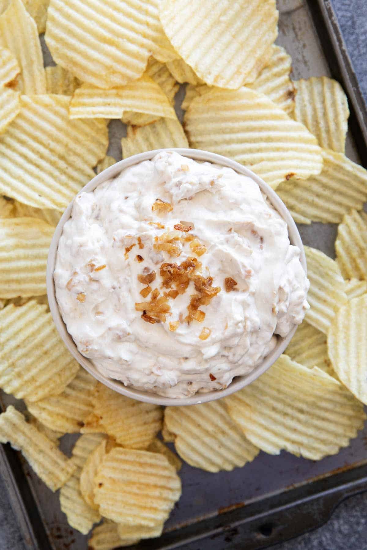 Bowl filled with French Onion Dip topped with caramelized onions.
