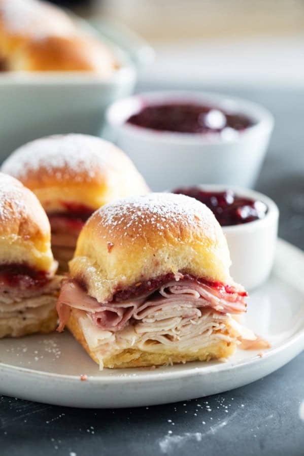 Monte Cristo Sliders on a plate with raspberry jam for serving.