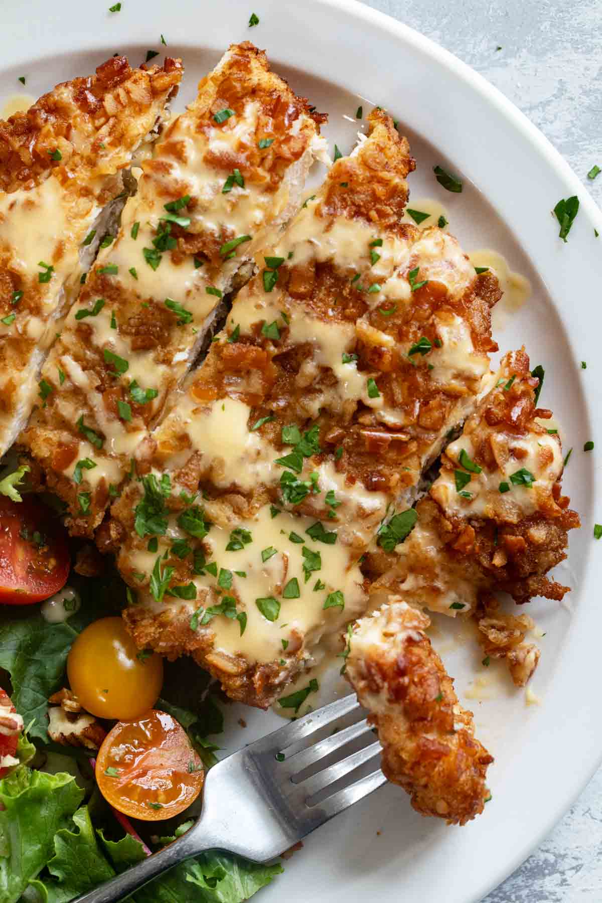 Pretzel Crusted Chicken with a bite on a fork.