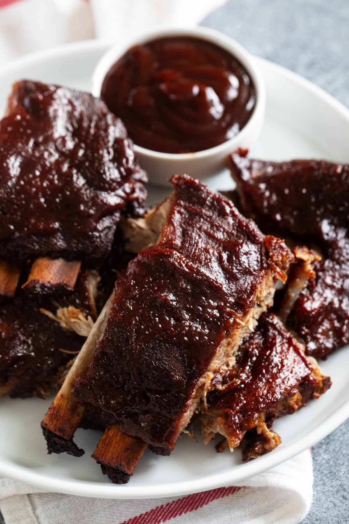 Slow Cooker Ribs covered in bbq sauce.