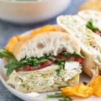 Chicken Pesto Sandwich cut in half on a plate.