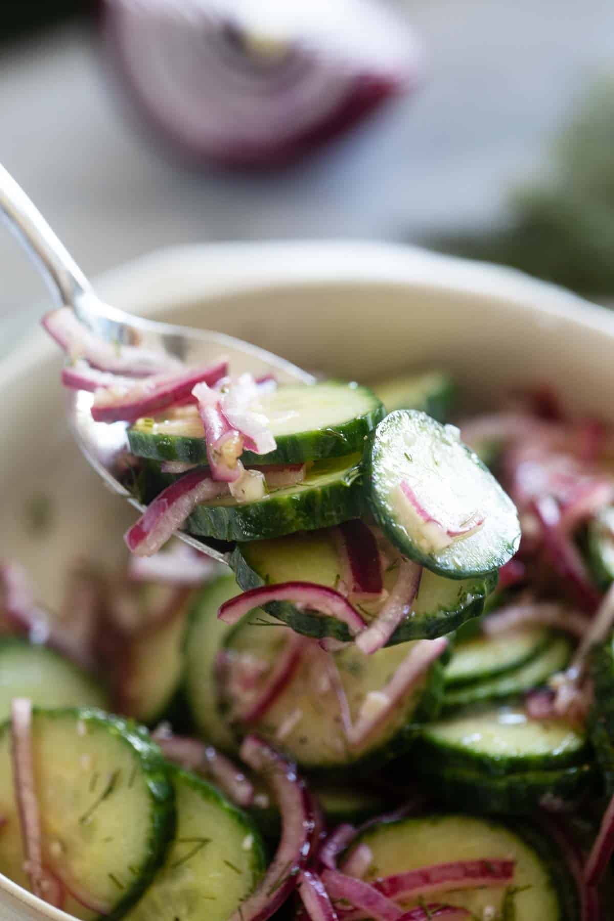 Cucumbers and onions on a fork.