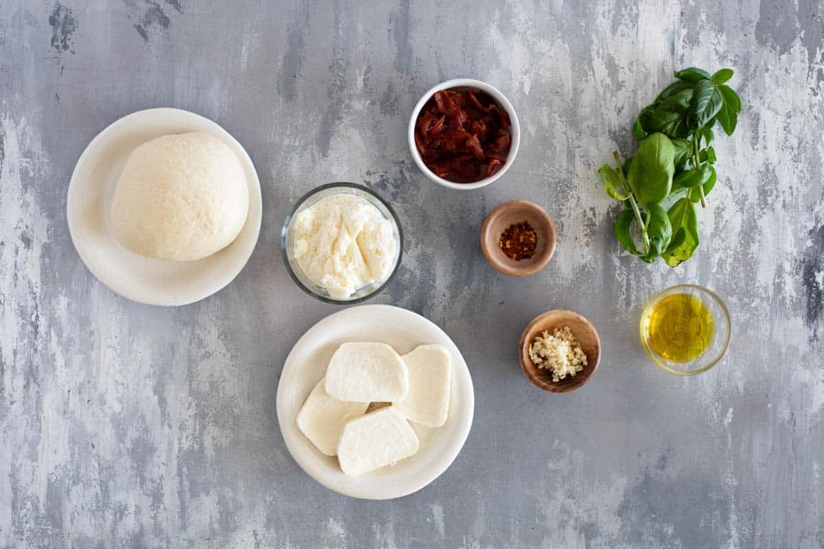 Ingredients for Grilled White Pizza with Bacon and Basil.