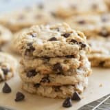 Stack of peanut butter oatmeal cookies on a cooling rack.