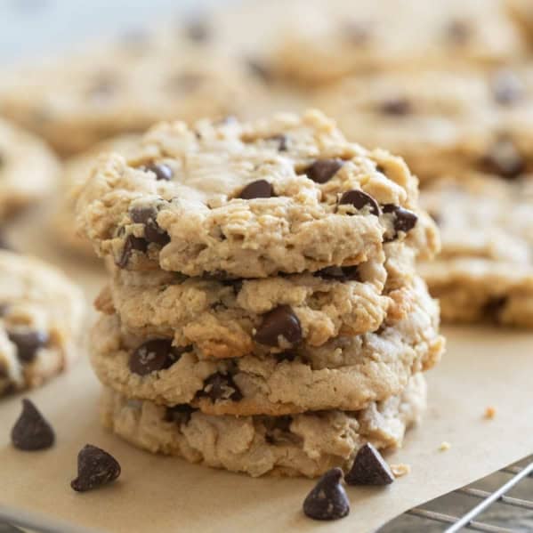 Stack of peanut butter oatmeal cookies on a cooling rack.