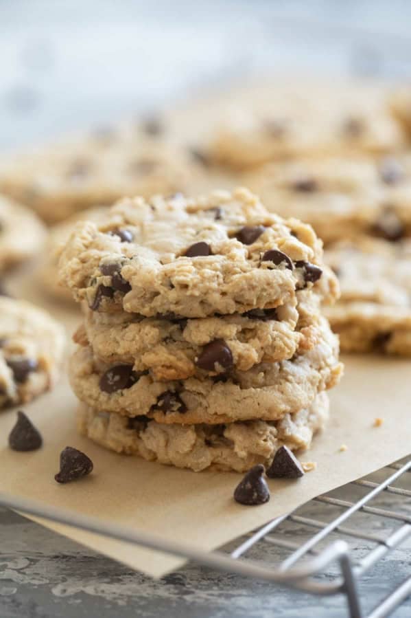Stack of peanut butter oatmeal cookies on a cooling rack.