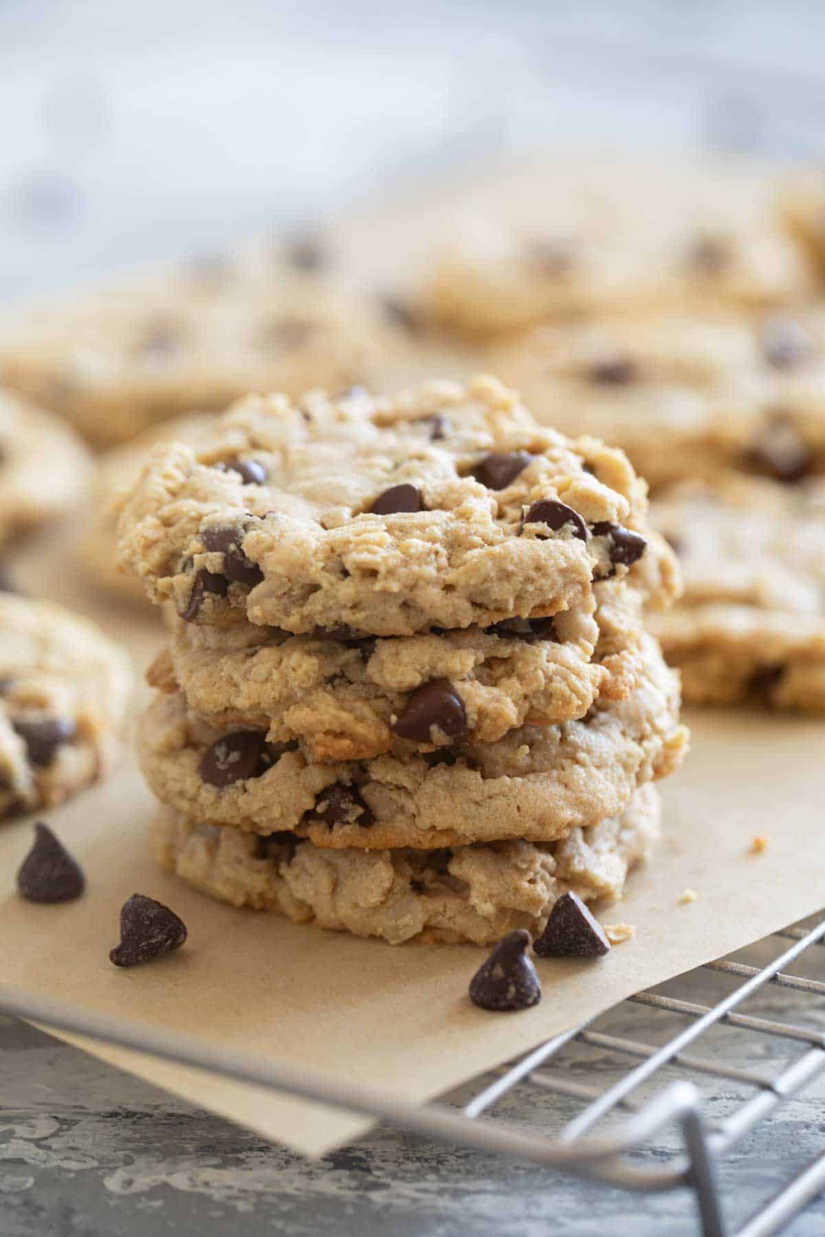Stack of peanut butter oatmeal cookies on a cooling rack.