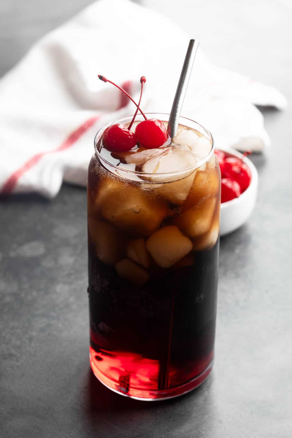 Roy Rogers Drink with grenadine and cola and maraschino cherries.