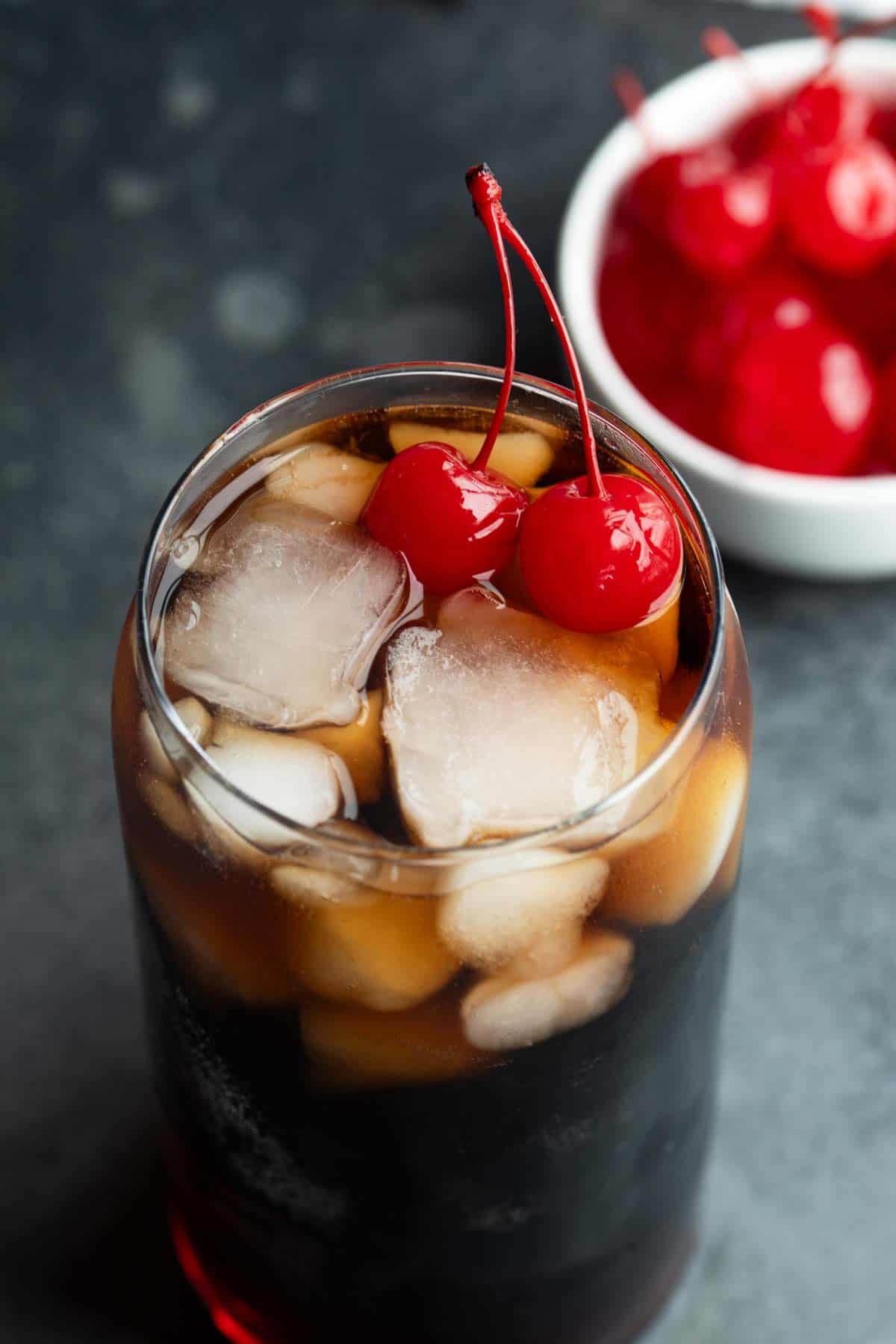 Roy Rogers Drink with ice and cherries.
