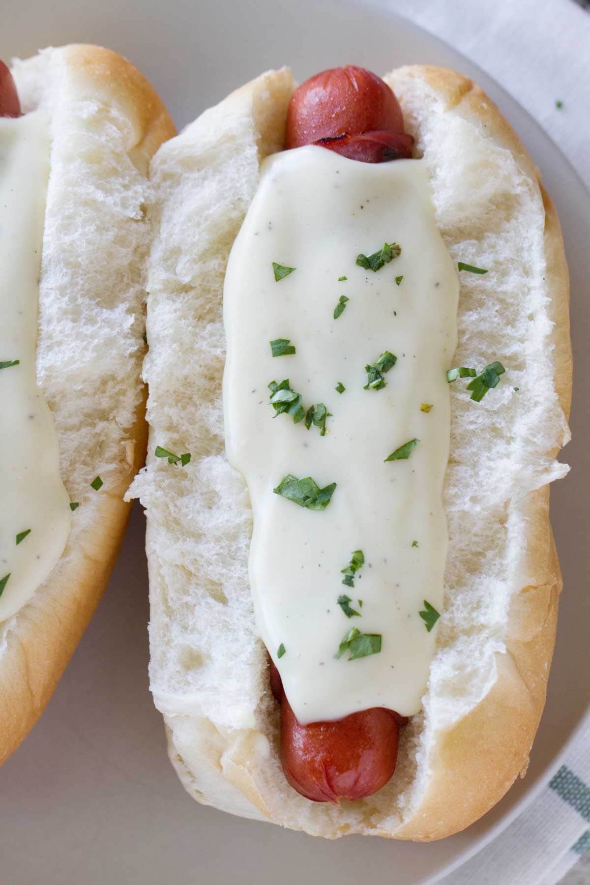 Cordon Bleu inspired hot dog topped with a creamy cheese sauce.