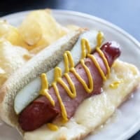 Cuban Hot Dogs with Swiss cheese, pickles, ham, and mustard.