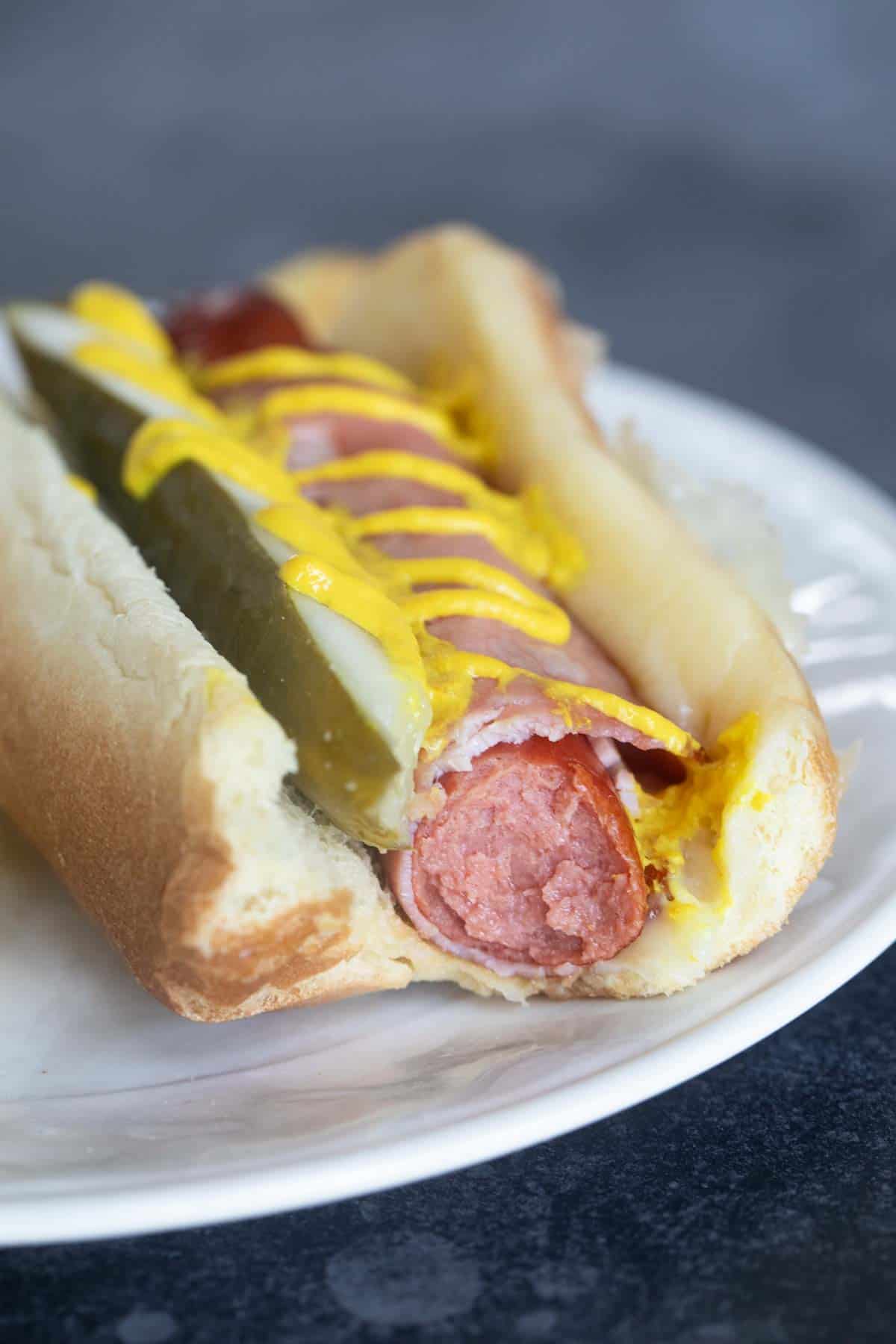 Cuban Hot Dog with a bite taken from it.
