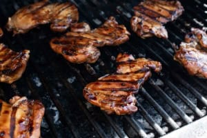 Honey Soy Chicken cooking on a grill.