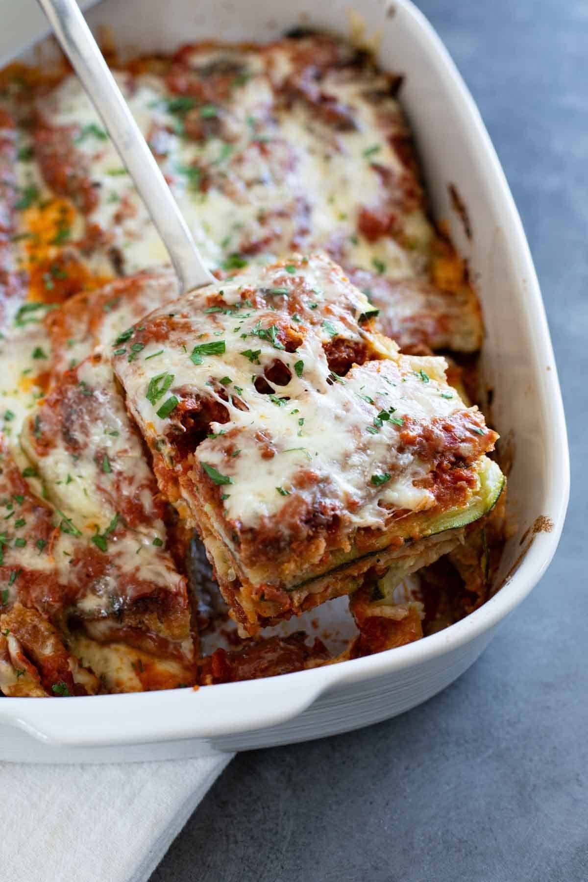 Dishing out a serving of Zucchini Parmesan.