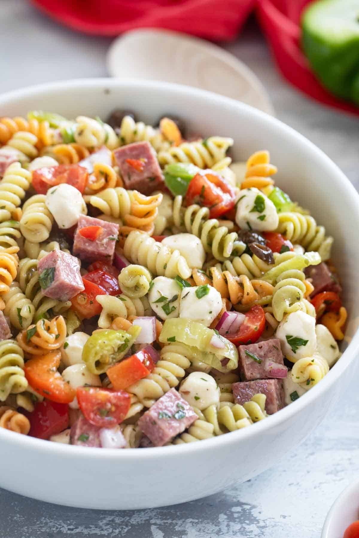 Bowl filled with Italian Pasta Salad with rotini pasta.
