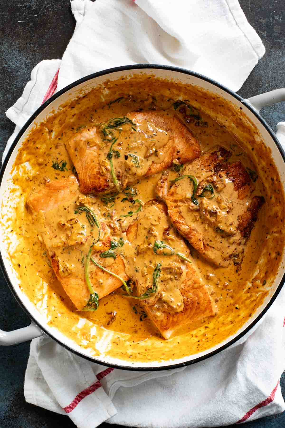 Tuscan Salmon in a skillet.