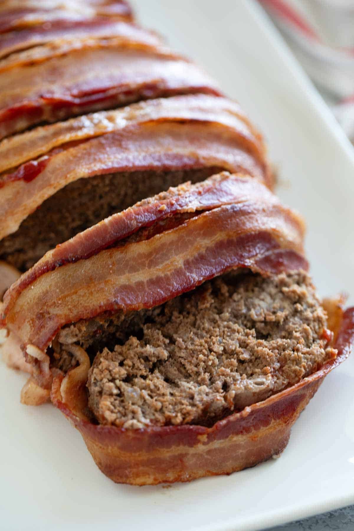 Bacon Wrapped Meatloaf cut into slices.