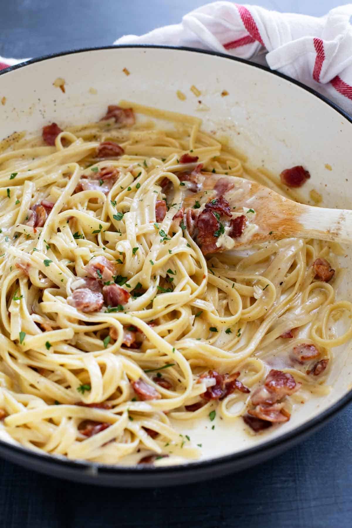 Skillet filled with Brie Pasta with Bacon.