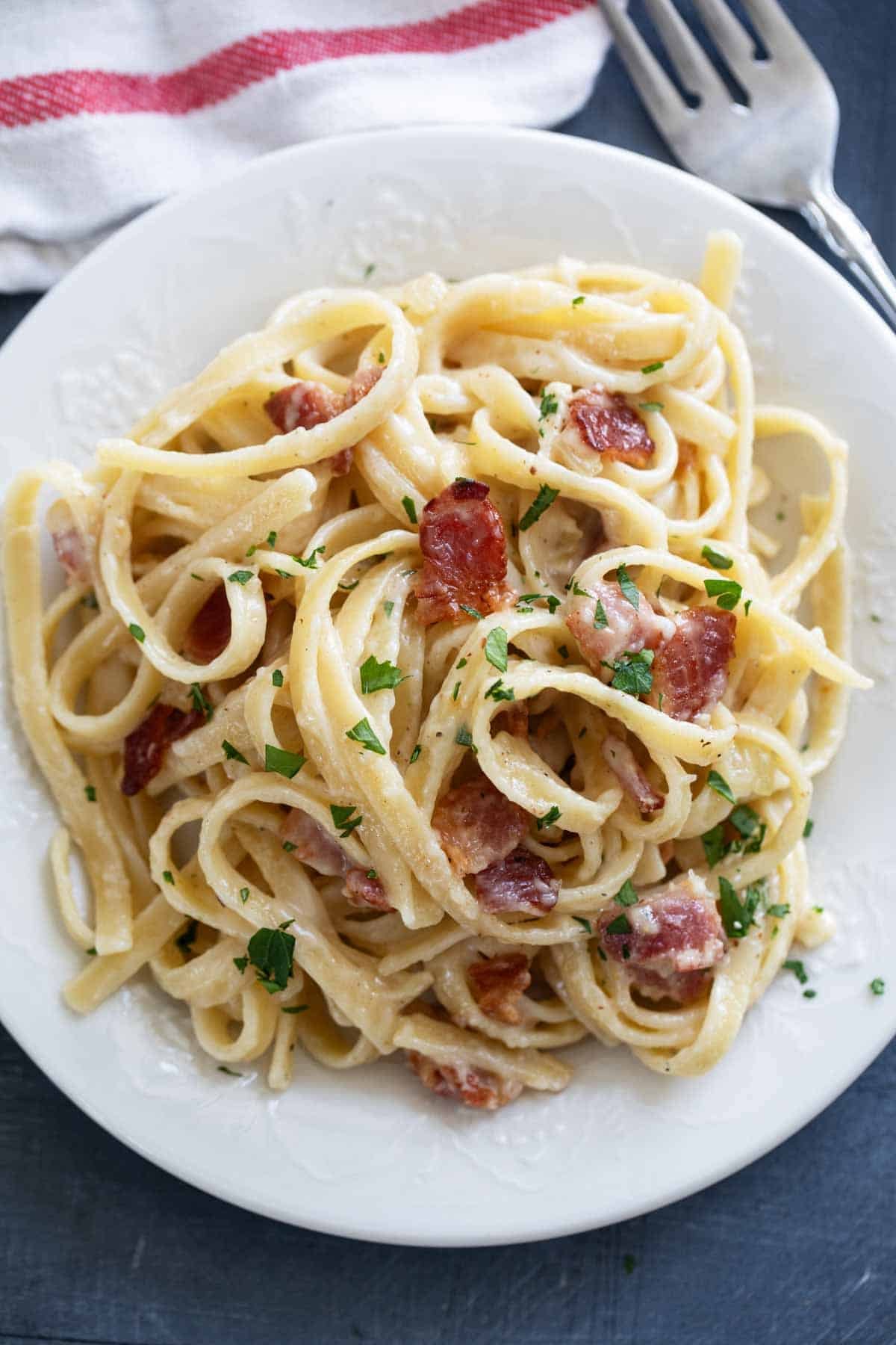 Plate with a serving of Brie Pasta with Bacon.