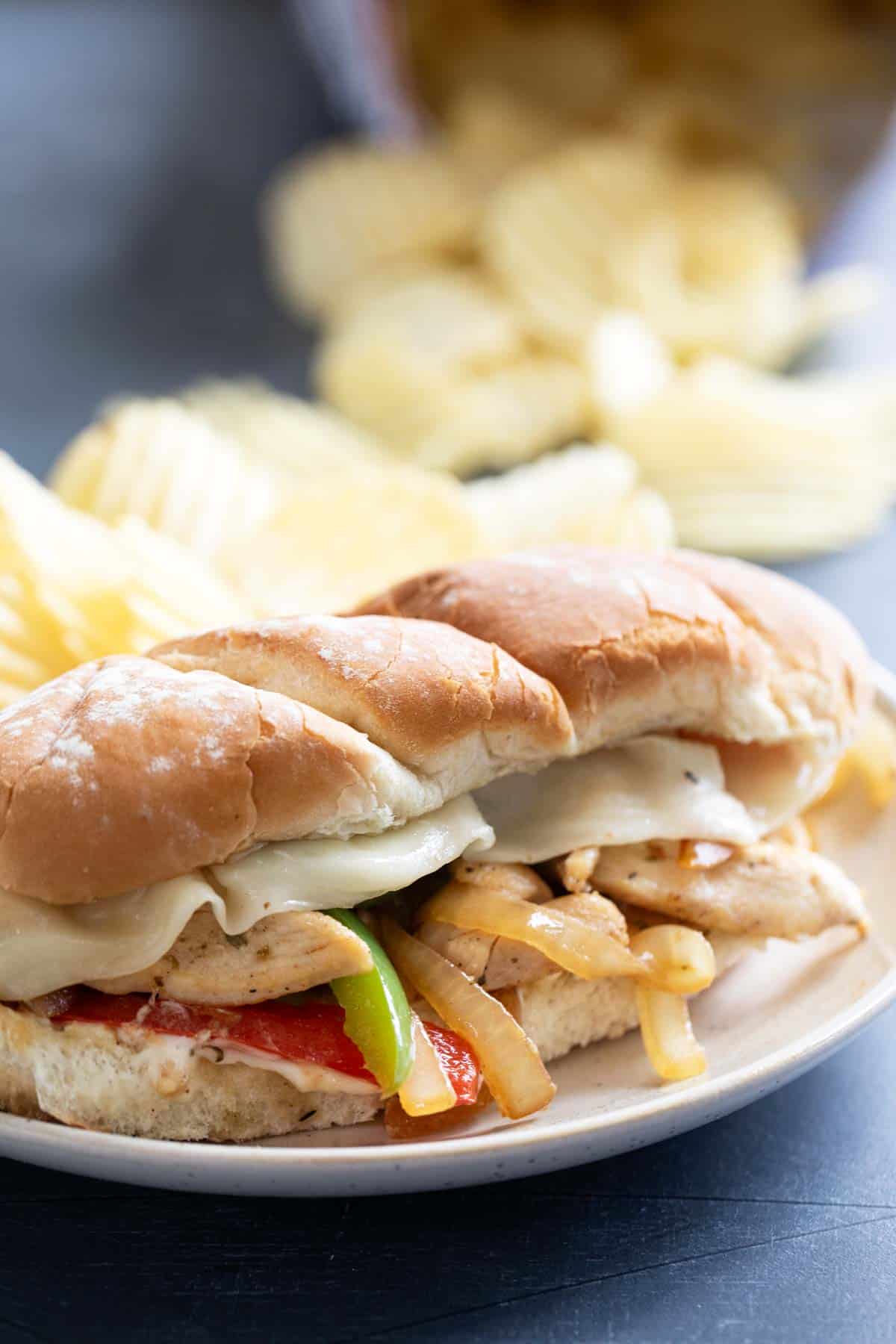 Chicken Cheesesteak Sandwich with red and green peppers and onions.