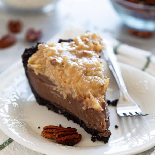 Slice of German Chocolate Pie topped with coconut pecan topping.