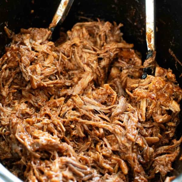 Crock pot filled with bbq pulled pork.