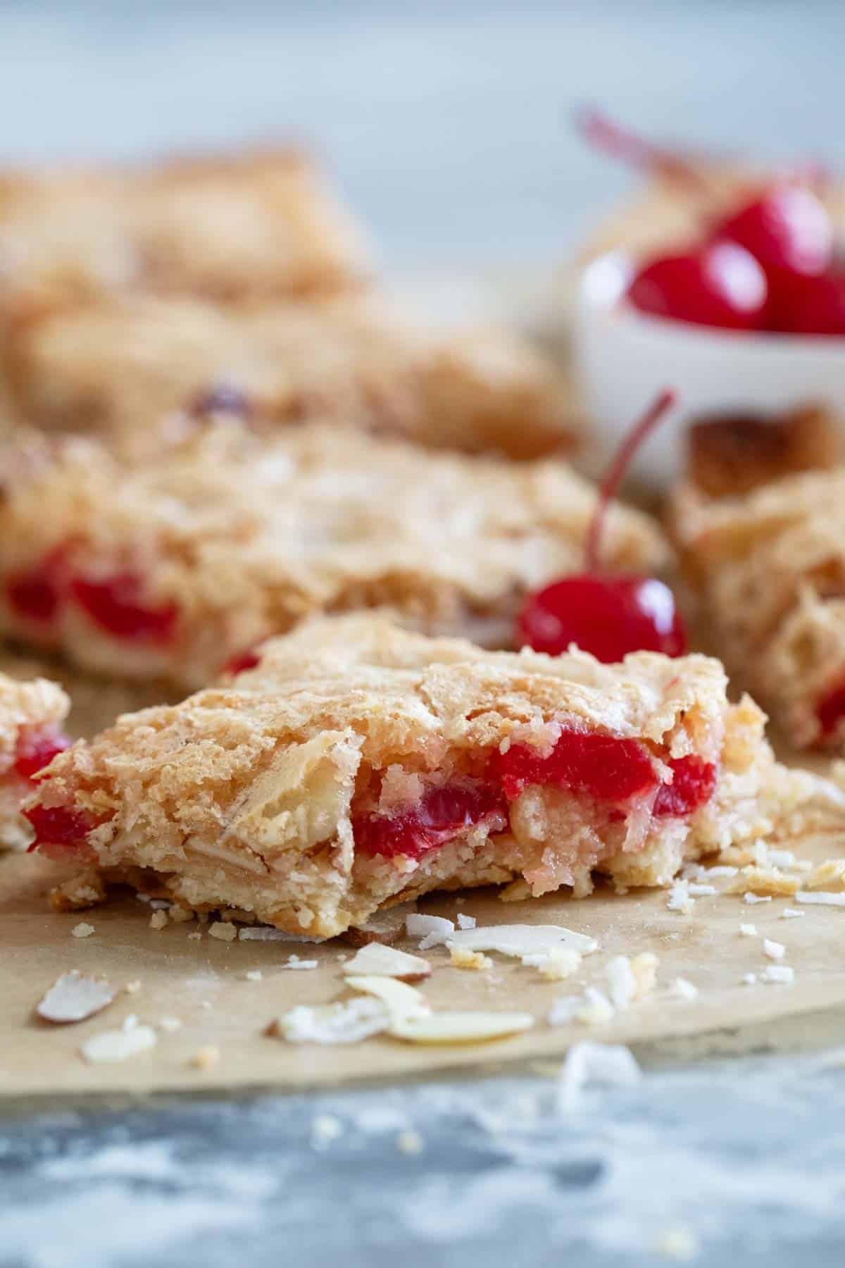Coconut Cherry Almond Bar with bite taken from it.