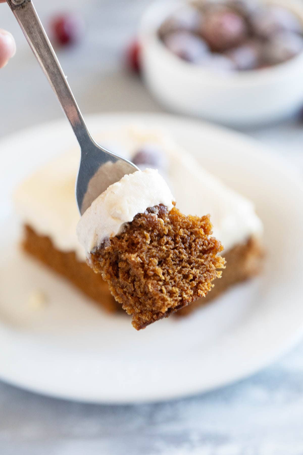 Bite of Gingerbread Cake on a fork.