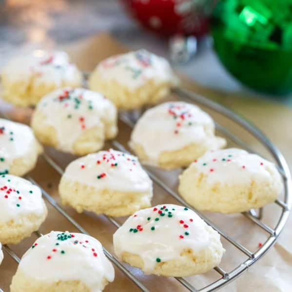 Italian Christmas Cookies topped with glaze and holiday sprinkles.