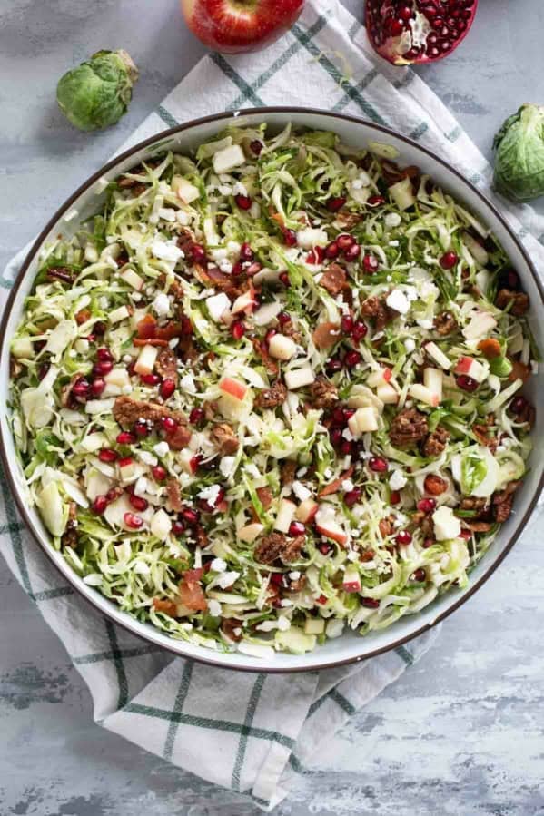 Shaved Brussels Sprout Salad with apples, pomegranates, candied pecans, feta, and bacon.