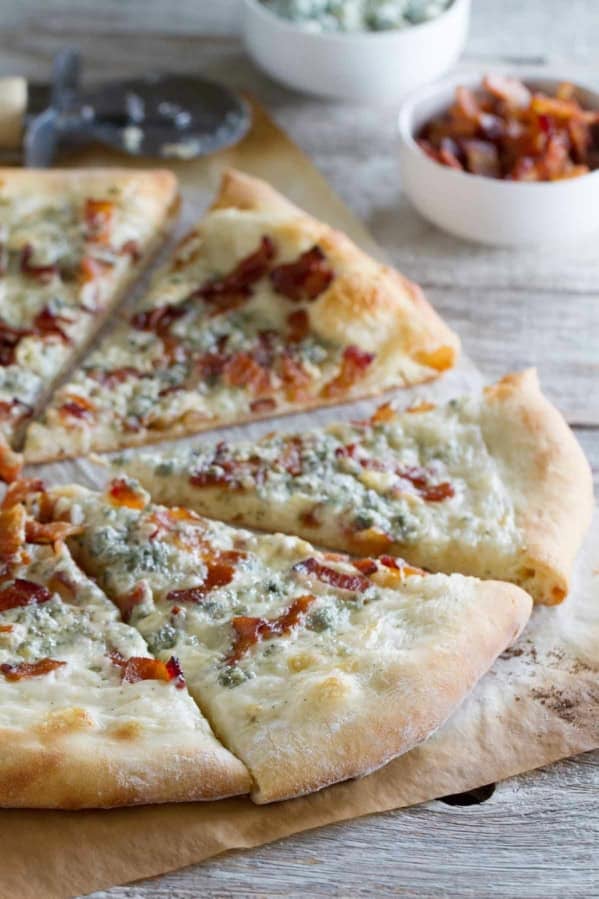 Blue Cheese and Bacon Pizza cut into slices.