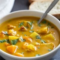 Bowl of Chicken Curry Soup topped with cilantro.