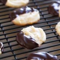 Chocolate Dipped Cookies on a cooling rack.