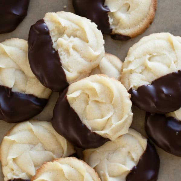 Chocolate Dipped Cookies stacked on top of each other.