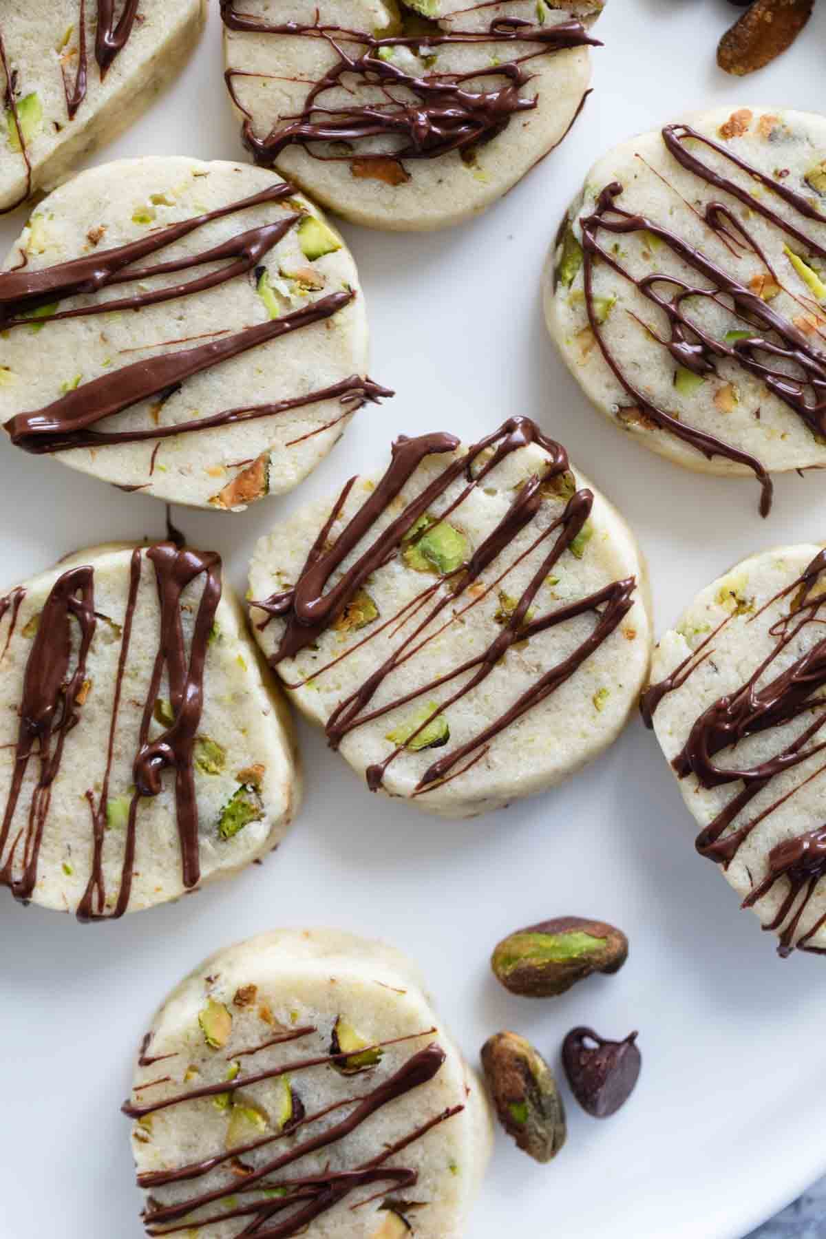 Pistachio Cookies drizzled with chocolate.