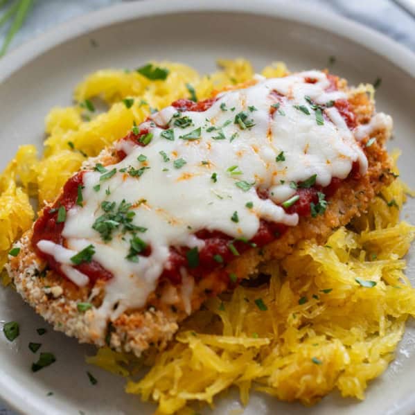 Baked Chicken Parmesan served over spaghetti squash.