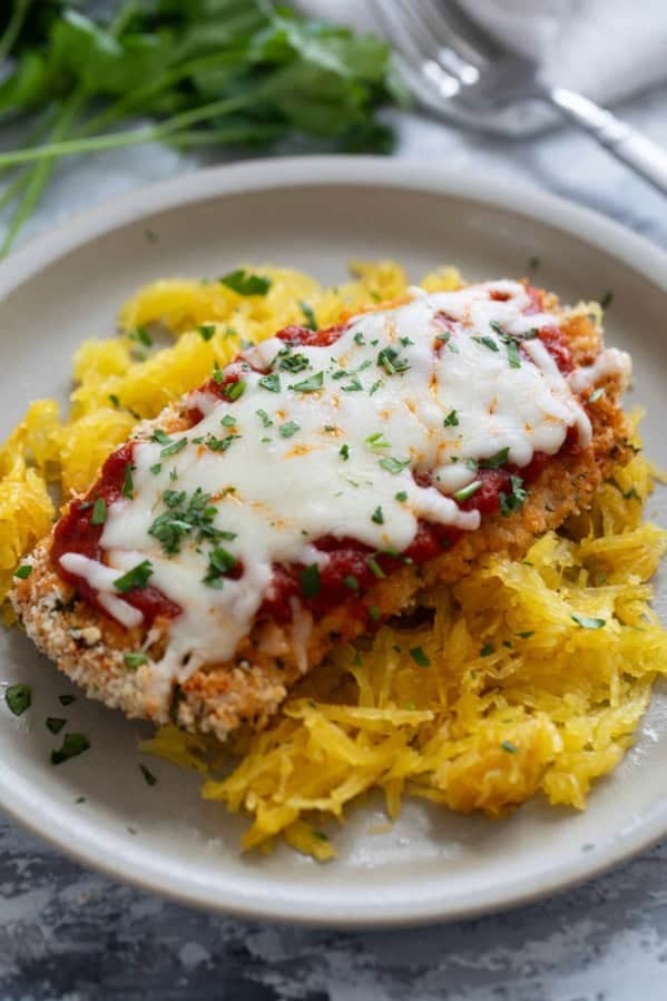 Baked Chicken Parmesan served over spaghetti squash.