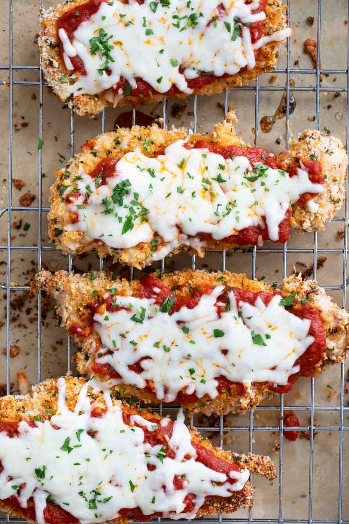 Baked Chicken Parmesan on a cooling rack.