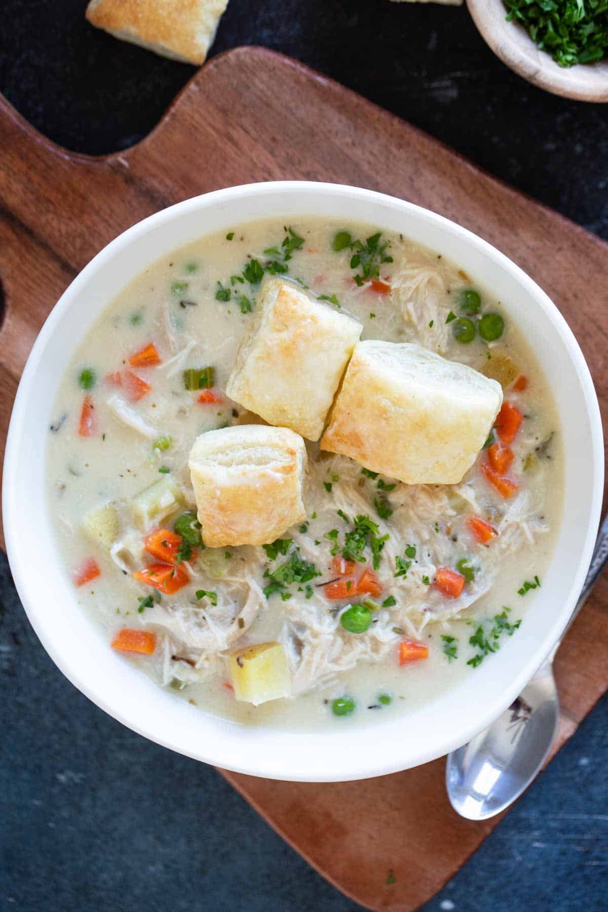 Chicken Pot Pie Soup topped with puff pastry squares.