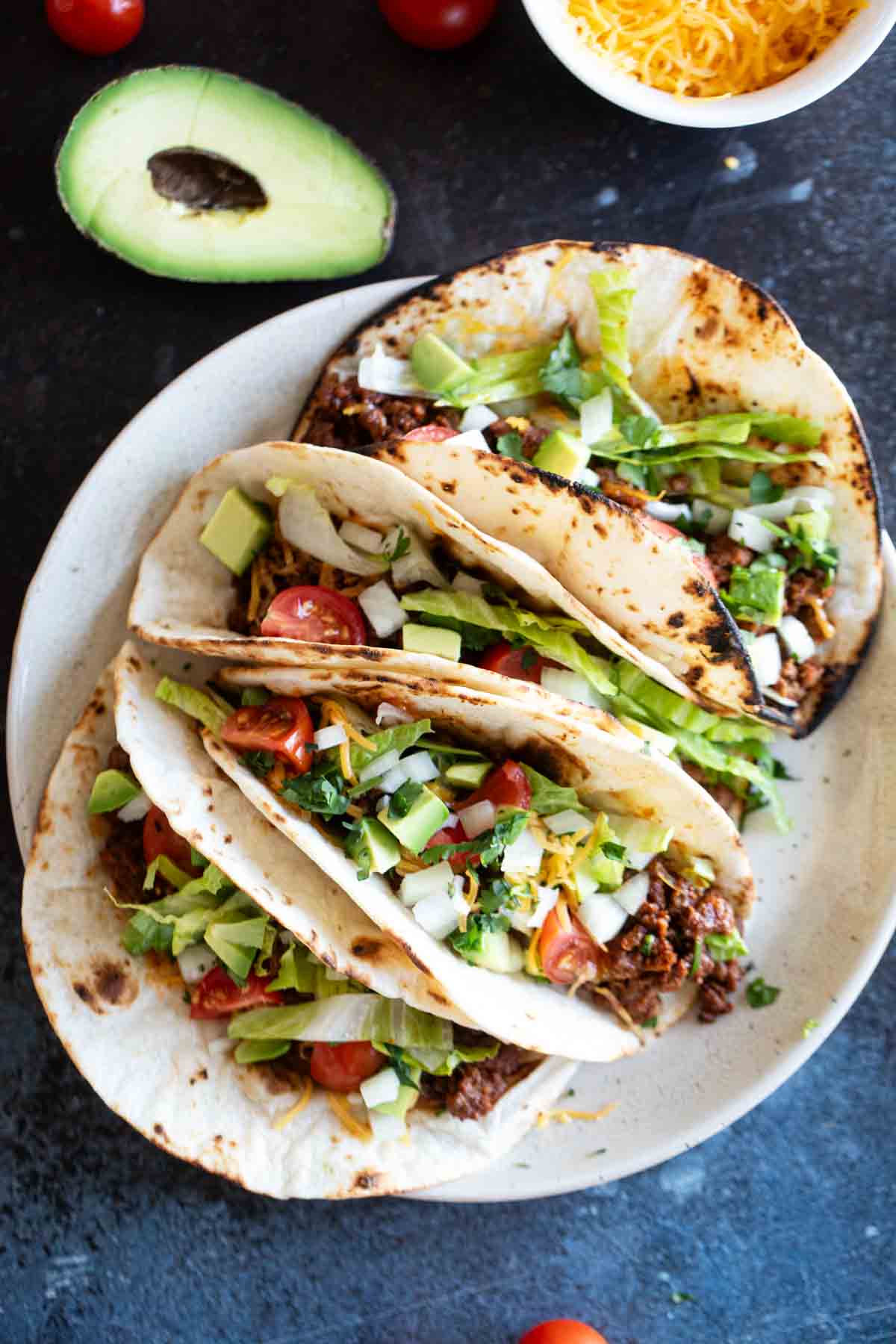 Four Ground Beef Tacos on a plate.