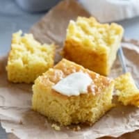 Sweet Boston Market Cornbread with a fork, topped with butter.